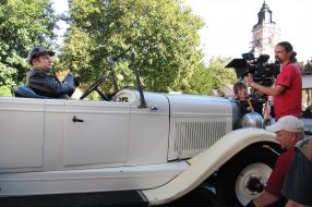 Actor sits in the car