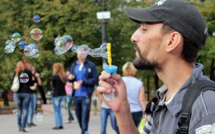 Participant of holiday of soap bubbles