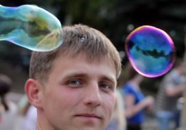 Participant of holiday of soap bubbles