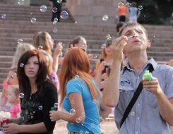 Participants of holiday of soap bubbles