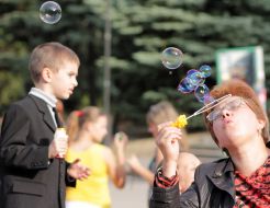 Participant of holiday of soap bubbles