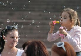 Participants of holiday of soap bubbles