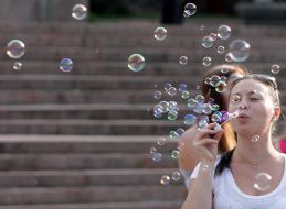 Participant of holiday of soap bubbles