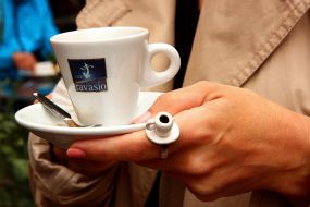 The girl with the ring in the form of a cup of coffee