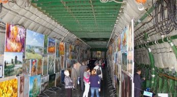 Visitors view paintings