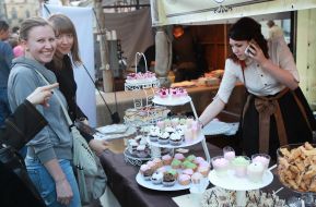 Visitors considering the festival sweets