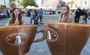 Girls in costume as a cup of coffee