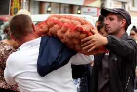 A man carrying potatoes