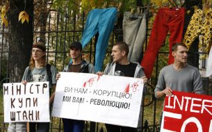Protesters holding posters