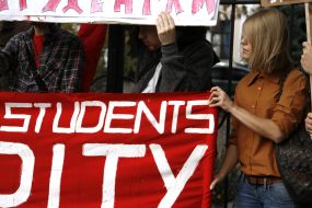 Protesters holding posters