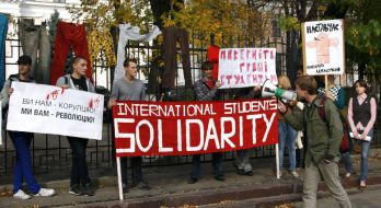Protesters holding posters