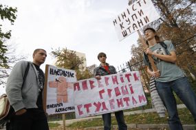 Protesters holding posters