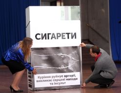 Protestors sets a pack of cigarettes