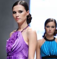 The model demonstrates clothes