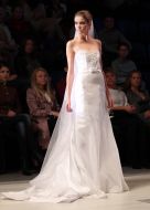 The model demonstrates clothes