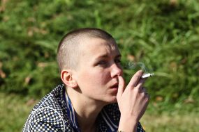 The girl smokes on Eco-Chic-Party 5