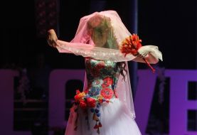 Model demonstrates a wedding dress