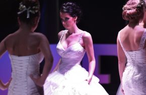 Model demonstrates a wedding dress