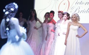 Models demonstrate a wedding dresses