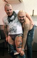 A man shows his tattoo