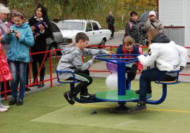 Children ride on the carousel