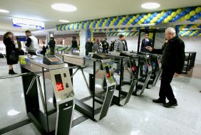A man walks through the turnstile