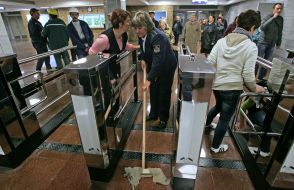 A cleaner washing the floor
