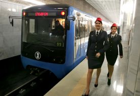 Workers are near subway train