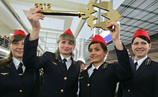 Metro worker holding a golden key