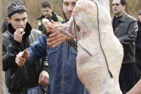 Muslim removes skin from sheep