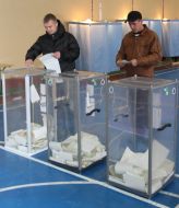 Voters cast ballots in the ballot box