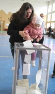 Voters cast ballots in the ballot box