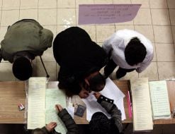 Voters receive ballots