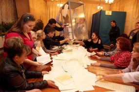Election commission members poured ballots