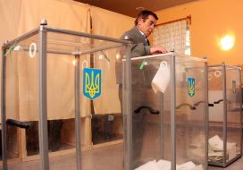 Man puts the ballot in the ballot box
