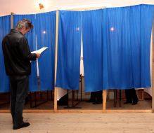 A man views a ballot