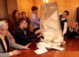Election commission members poured ballots