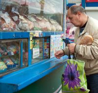 A man buys a long loaf
