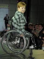 The model demonstrates clothes