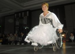 The model demonstrates clothes