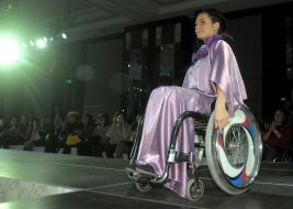 The model demonstrates clothes