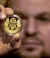 Dmitriy Pirkl showing anniversary medal