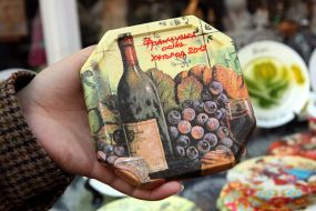 A girl holds a cupboard