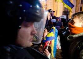 Participant of the meeting speaks with fighters of special "Berkut"