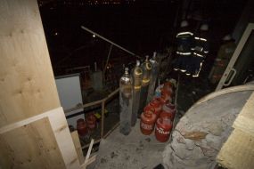 Firefighters in fire extinguishing place