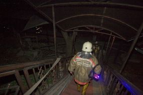 Firefighters in fire extinguishing place