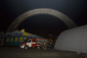 Firefighters in fire extinguishing place