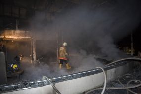 Firefighters in fire extinguishing place