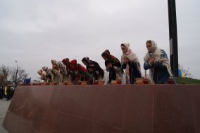 The participants of ceremony of laying flowers