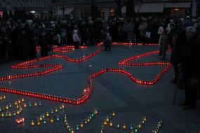 Cross laid out from icon lamps